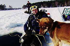 Andy Driver with Alice the Mad Dog<BR> New Hampshire ice diving, March 1996.