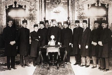 pictory: Abdolhossein Teymūrtāsh and Court Officials stand behind Pahlavi Crown (1926)