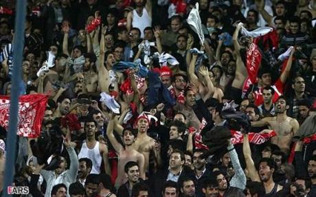Iranian Azerbaijani soccer fans take off their clothes in sympathy with earthquake victims 