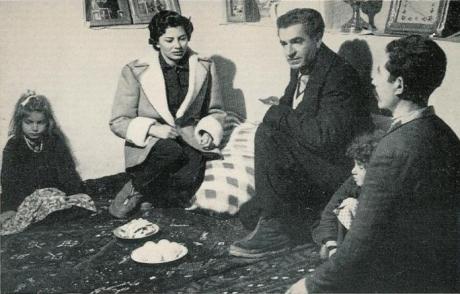 ROYALTY AND THE PEOPLE: Shah and Soraya Share meal with worksman's family (1956)
