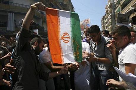 Syrian Protestors Burn IRI Flag
